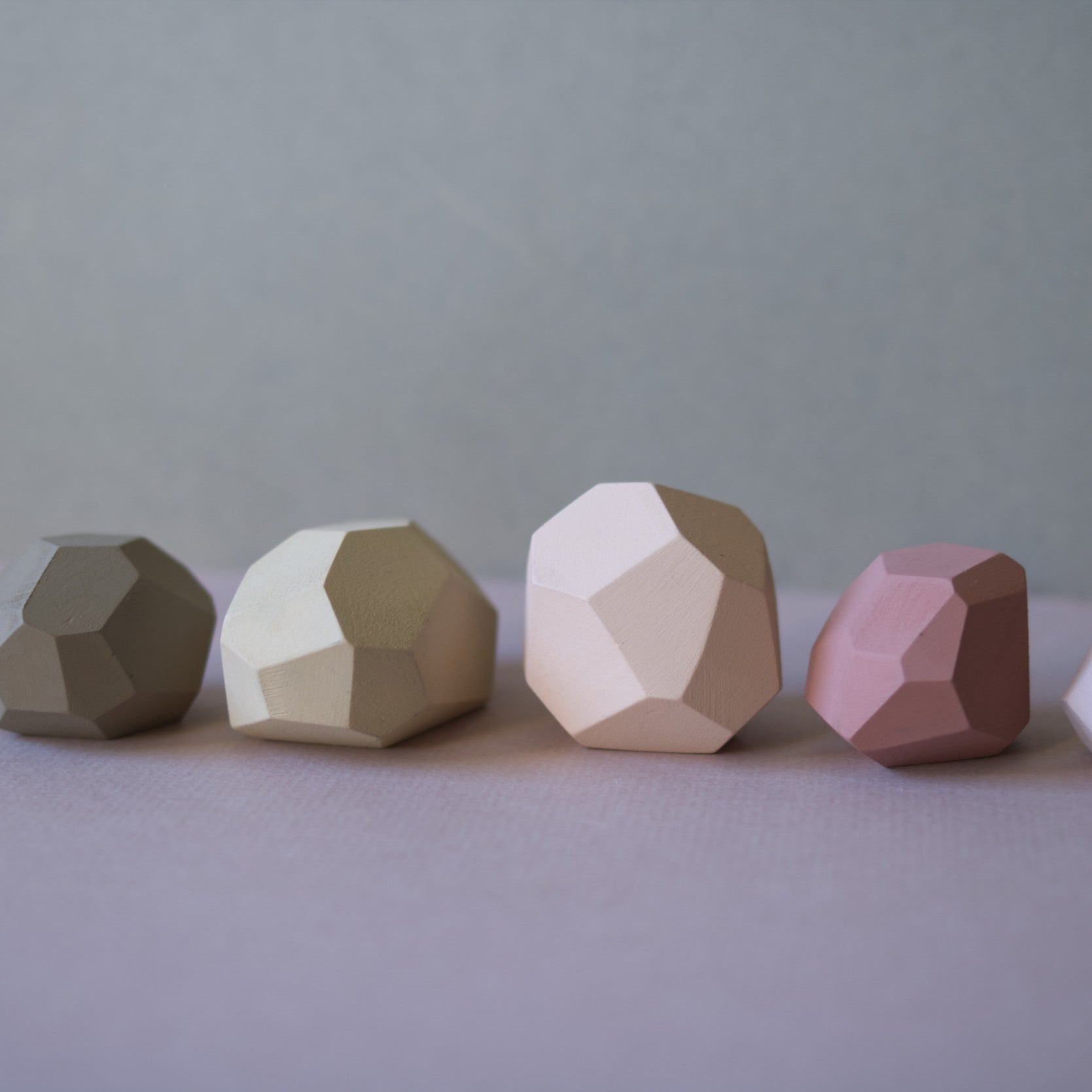 Zen balancing stones on a beige background