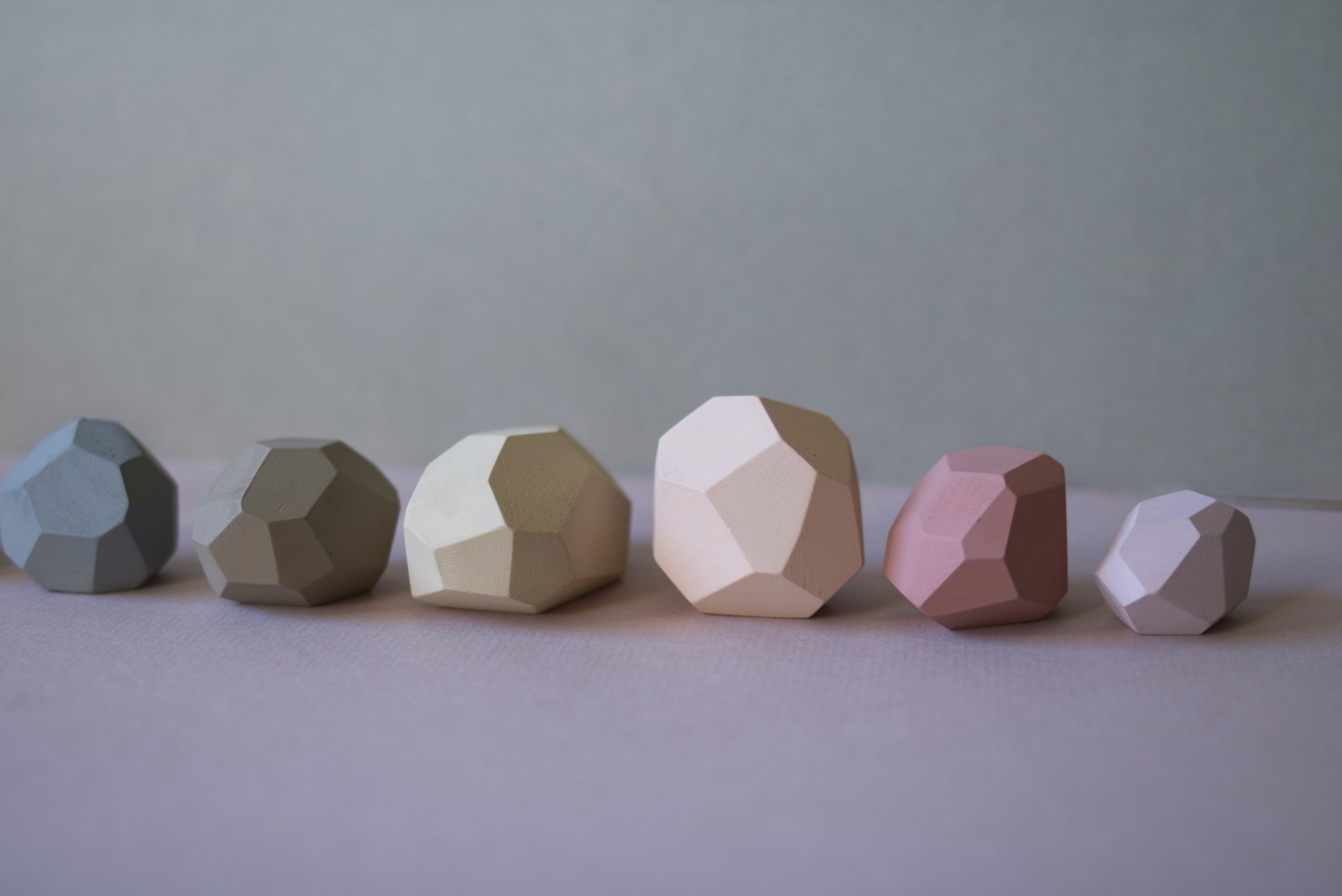 Zen balancing stones on a beige background